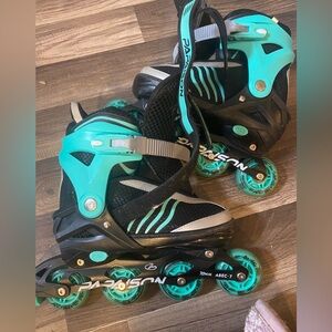Black and teal kids rollerblades